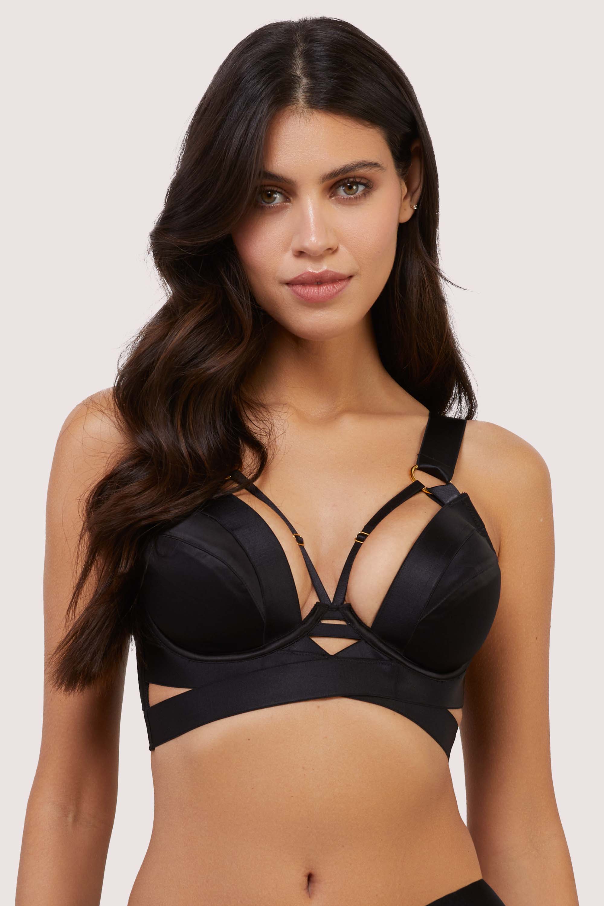 model wears black satin plunge bra with straps