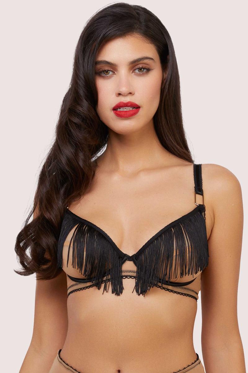 Model wears retro nude mesh push up bra with black fringing