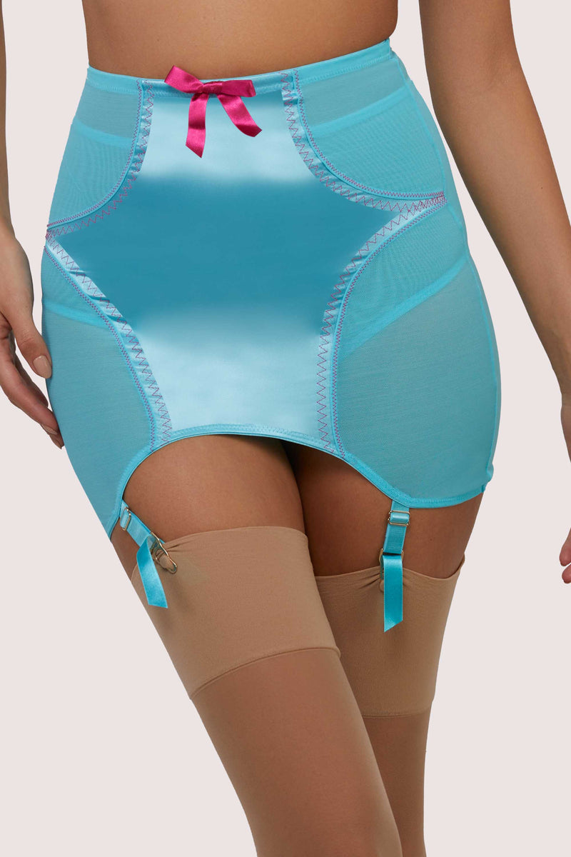 Model wears retro electric sky blue girdle with suspender straps and stockings