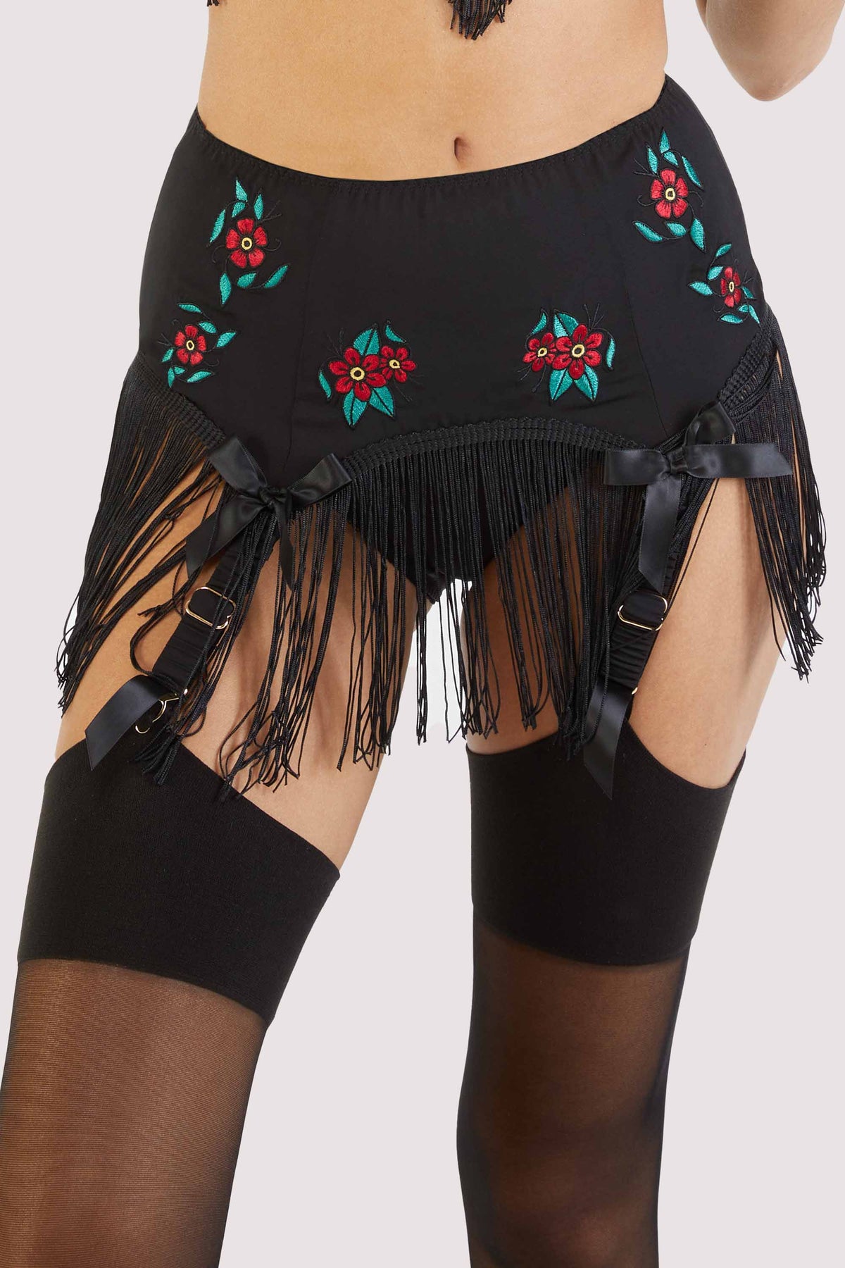 Black fringe-lined suspender belt with embroidered red flowers