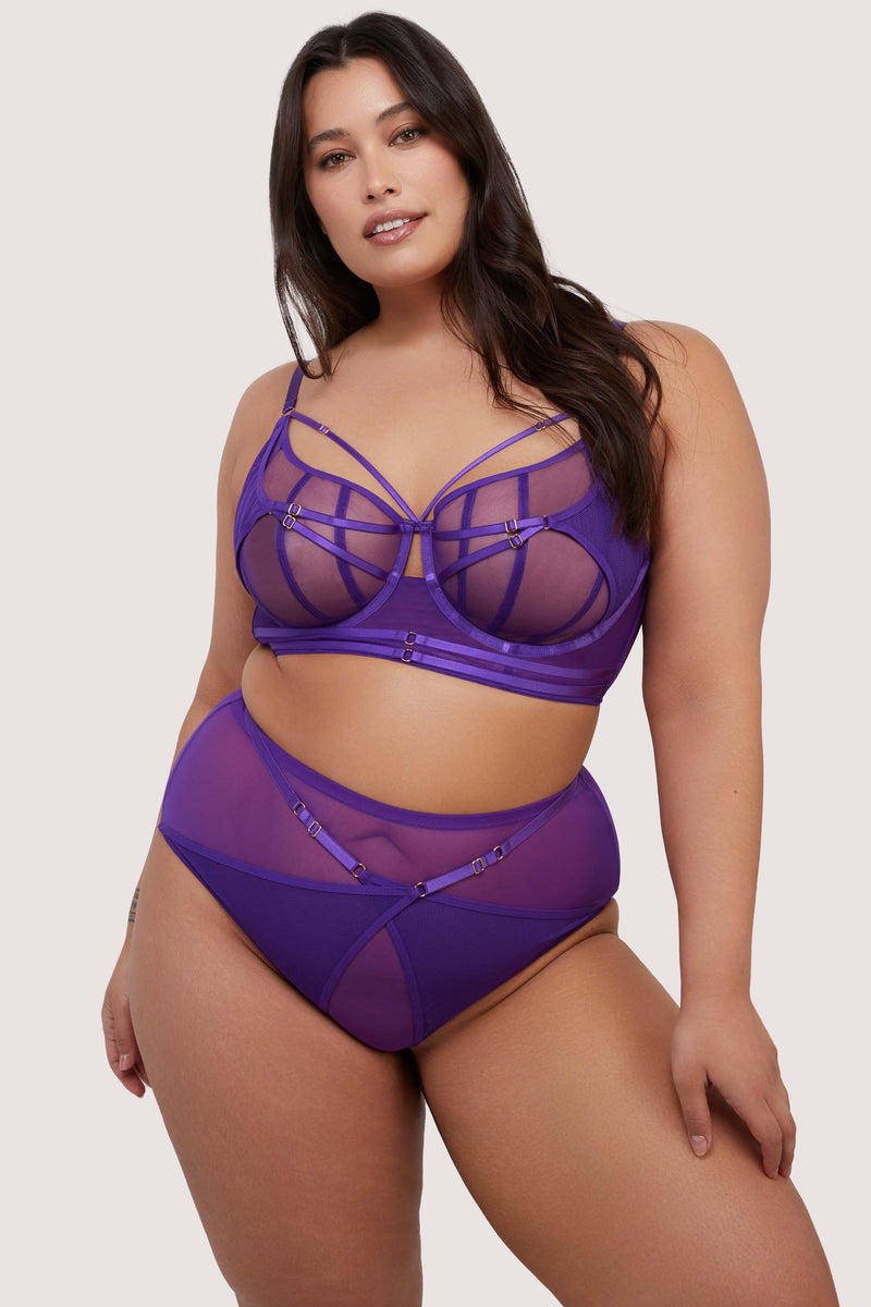 model wears purple sheer mesh bra and thong with straps