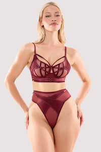 Model wears a eddie wine crossover high waist thong with a matching bra.