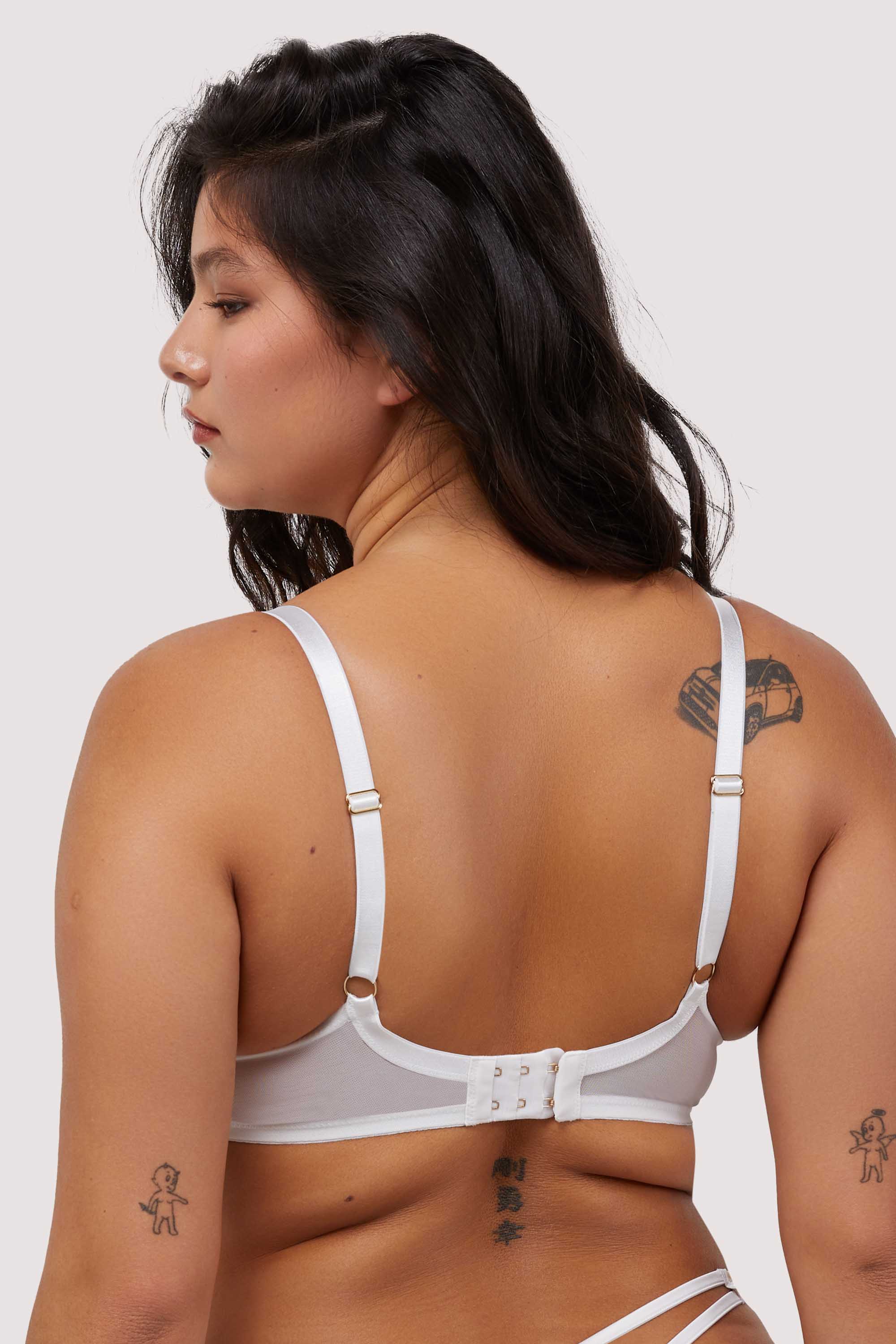 Model shows hook and eye fastening back and adjustable straps of white plunge bra