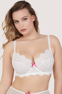 Model wears sexy white broderie anglaise balconette bra with shoulder straps