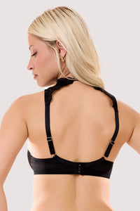 Model shows the back of a faye black graphic embroidery high neck plunge bra with a sheer mesh and graphic embroidery.