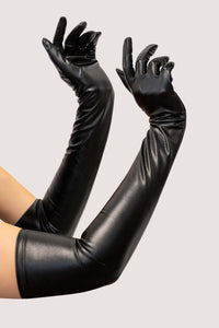Model wears long black vegan leather gloves