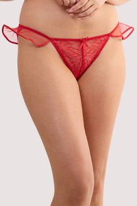 Model wears a monica red ribbon slot lace brief with sheer mesh with scalloped lace and red ribbon slot detailing with satin rose.