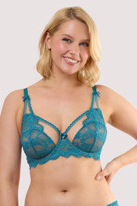 Model wears a teal eyelash lace balconette bra with underwired balconette cups and nude mesh with teal eyelash lace.