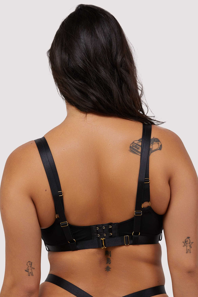 Model wears black mesh balcony bra with harness straps