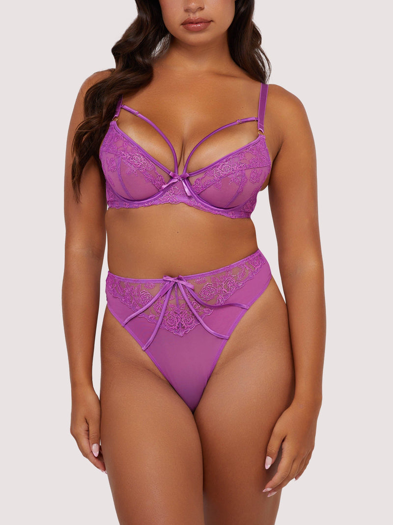 Model wears purple strappy lace lingerie set