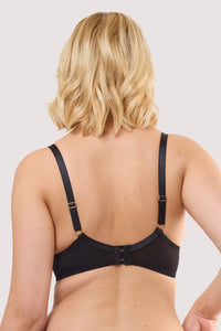 Model shows the back of a roisin black & wine chiffon quarter cup bra with adjustable straps and hook and eye fastening.