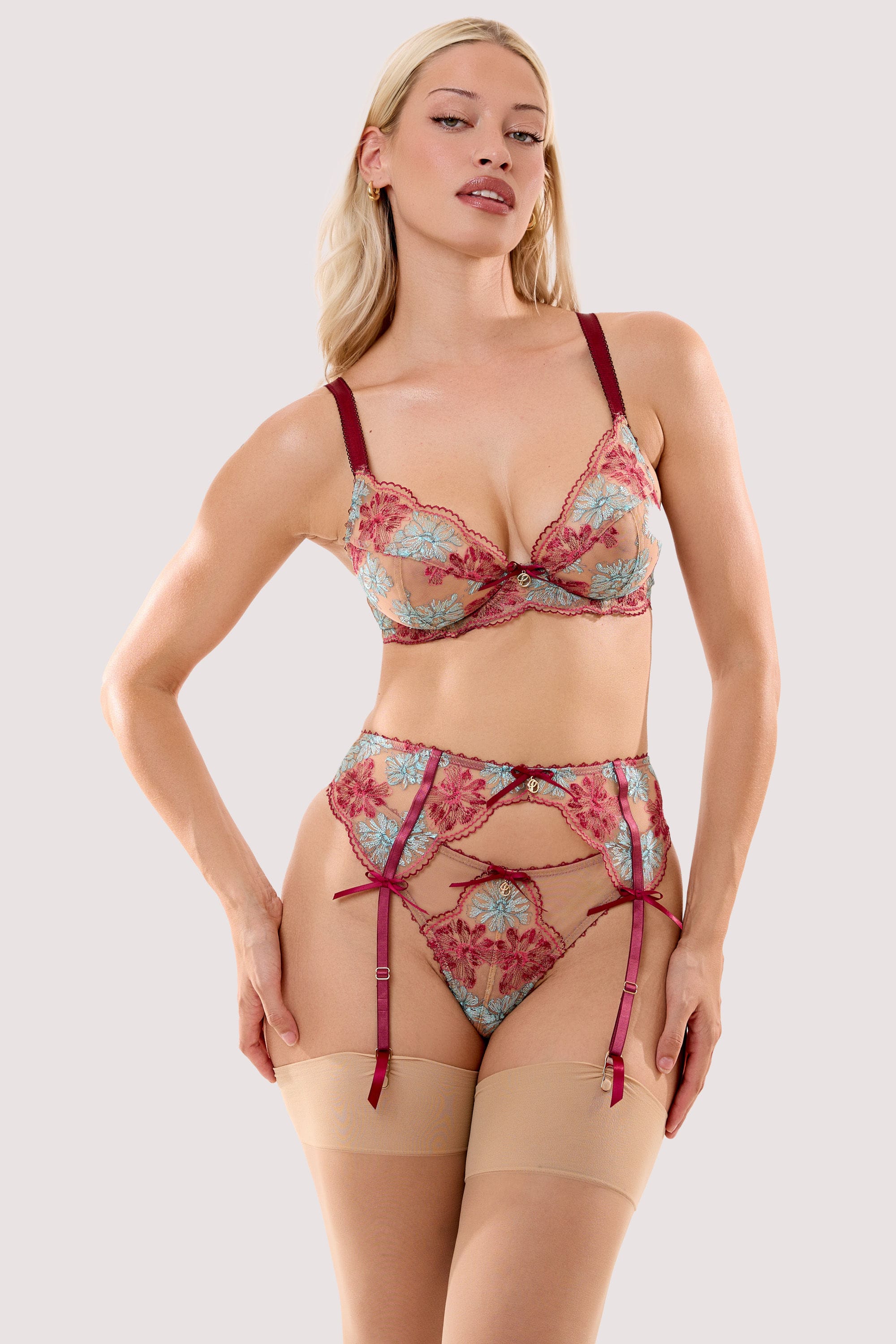 Model wears a persephone ivory & wine floral embroidery suspender belt with a matching thong and bra.