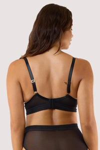 Model wears black sheer plunge bra with matching high waist brief sheer mesh plunge cups longline underband
