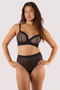 Model shows back of black sheer plunge bra with  adjustable straps hook and eye fastening longline underband
