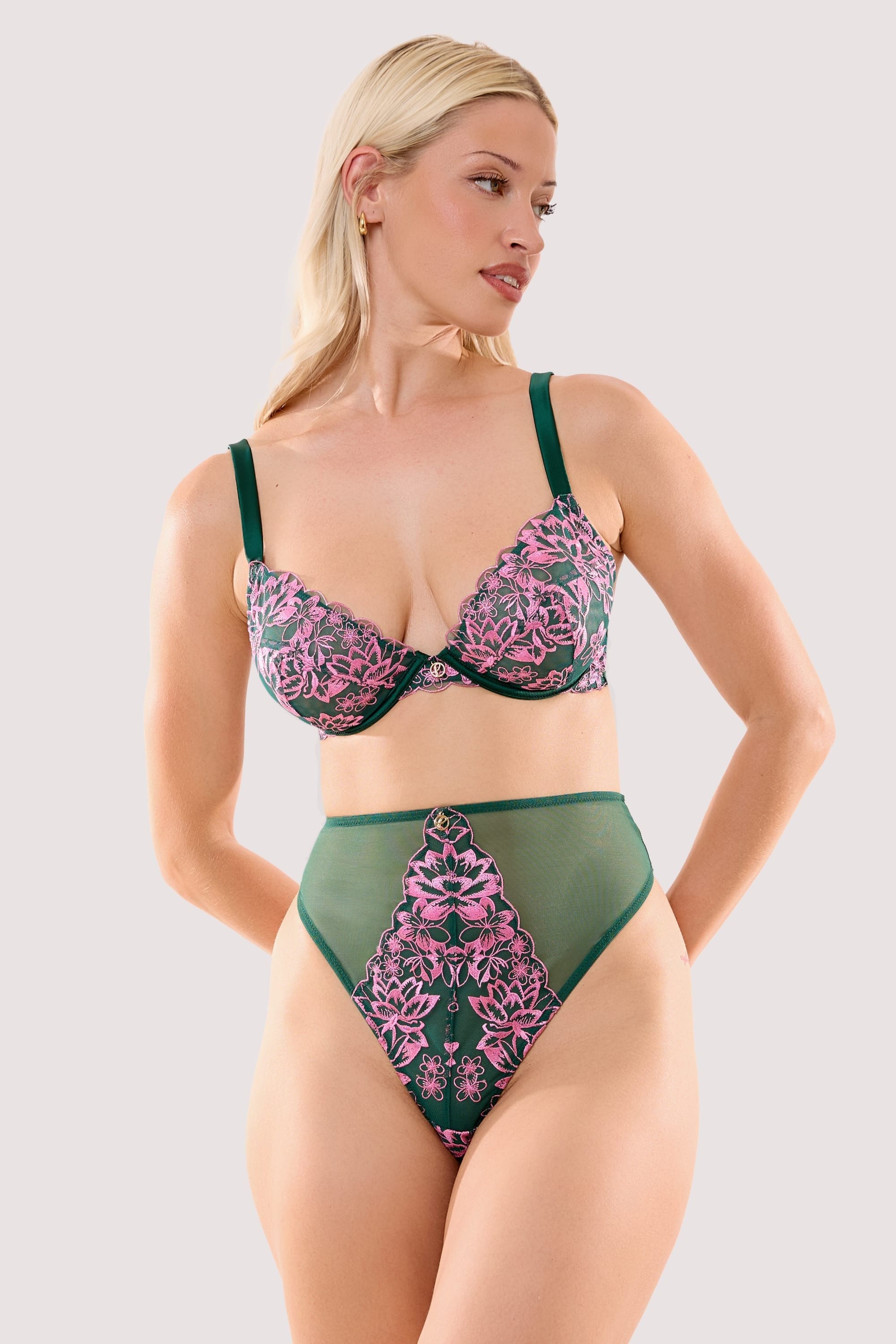 Model wears a ada blossom green & pink high waist thong with a matching bra.