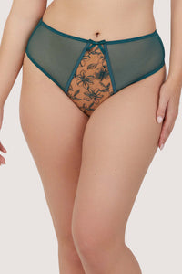 Model wears teal contrast embroidery balconette bra with underwire plunge cups, nude mesh, and teal floral embroidery, featuring thick adjustable straps and satin seam detailing