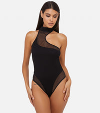 Model wearing black asymmetric mesh and jersey thong bodysuit with high neck and sheer panel detailing