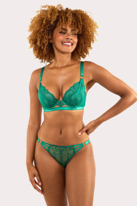 Model wears forest green deco embroidered plunge bra with scalloped lace and gold hardware, styled with matching breif