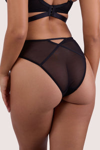 Model shows back of dark green mesh high waist brief and crossover waistband detail